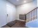 Bright entryway with hardwood floors and staircase at 145 Lost Cove Sw Dr, Atlanta, GA 30331