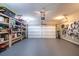 Two-car garage with built-in shelving and workspace at 145 Lost Cove Sw Dr, Atlanta, GA 30331