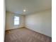 Bright and airy bedroom with neutral carpeting and a large window at 1822 Emory Ln # 89, Conyers, GA 30013