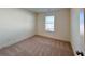 Well-lit bedroom with neutral walls and carpet, offering a peaceful atmosphere at 1822 Emory Ln # 89, Conyers, GA 30013