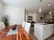 Dining area with rustic wood table and white chairs at 1822 Emory Ln # 89, Conyers, GA 30013