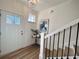 Bright entryway with staircase, storage, and coat closet at 1822 Emory Ln # 89, Conyers, GA 30013