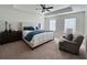 King-size bedroom with plush carpeting, a ceiling fan and plenty of natural light at 1822 Emory Ln # 89, Conyers, GA 30013