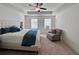 Spacious main bedroom with king bed, ceiling fan, and ample natural light at 1822 Emory Ln # 89, Conyers, GA 30013