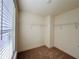 Large walk-in closet with ample shelving and natural light from a window at 1822 Emory Ln # 89, Conyers, GA 30013