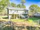 Spacious backyard with deck, fenced area and storage shed at 456 Pine Shadows Dr, Dallas, GA 30157