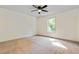 Spacious bedroom featuring a large window and ceiling fan at 456 Pine Shadows Dr, Dallas, GA 30157