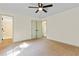 Bedroom with carpet, ceiling fan, and access to bathroom at 456 Pine Shadows Dr, Dallas, GA 30157