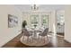 Bright dining area with a round table, four chairs and stylish rug at 456 Pine Shadows Dr, Dallas, GA 30157