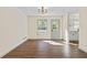 Spacious dining room with hardwood floors and access to the backyard at 456 Pine Shadows Dr, Dallas, GA 30157
