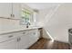 Renovated kitchen with white cabinets, subway tile backsplash, and quartz countertops at 456 Pine Shadows Dr, Dallas, GA 30157