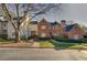 Brick front of charming townhome with landscaping at , Atlanta, GA 30327