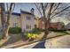 Beige townhome with manicured landscaping and mature trees at , Atlanta, GA 30327