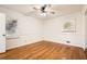 Bright bedroom with hardwood floors and ceiling fan at 1276 Hickory Sw Dr, Lilburn, GA 30047