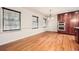 Hardwood floor dining room with chair rail and kitchen access at 1276 Hickory Sw Dr, Lilburn, GA 30047