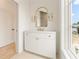 Modern bathroom with white vanity and arched mirror at 145 Arcadia Ave, Fayetteville, GA 30214