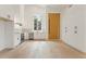 Modern kitchen with white cabinets and light wood floors at 145 Arcadia Ave, Fayetteville, GA 30214