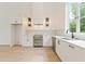 Modern kitchen with stainless steel appliances and white cabinets at 145 Arcadia Ave, Fayetteville, GA 30214