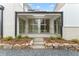 Covered patio with stone steps and sliding glass doors at 145 Arcadia Ave, Fayetteville, GA 30214