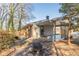 Brick home with spacious deck and fire pit area in the backyard at 3390 Kenland Se Rd, Smyrna, GA 30082