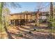 House back view with deck and wooded area at 3390 Kenland Se Rd, Smyrna, GA 30082