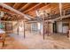 Unfinished basement featuring laundry hookups and shelving units at 3390 Kenland Se Rd, Smyrna, GA 30082