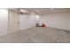 Finished basement with carpeted floor and door at 3390 Kenland Se Rd, Smyrna, GA 30082