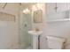 Updated bathroom with walk-in shower and pedestal sink at 3390 Kenland Se Rd, Smyrna, GA 30082