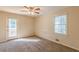 Bright bedroom with carpet flooring and private access to deck at 3390 Kenland Se Rd, Smyrna, GA 30082