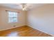 Hardwood floor bedroom with window and ceiling fan at 3390 Kenland Se Rd, Smyrna, GA 30082