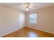 Bedroom with hardwood floors, window, and ceiling fan at 3390 Kenland Se Rd, Smyrna, GA 30082