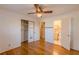 Bedroom with hardwood floors, mirrored closet, and access to bathroom at 3390 Kenland Se Rd, Smyrna, GA 30082