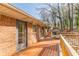 Back deck with wood railings, offering a view of the wooded backyard at 3390 Kenland Se Rd, Smyrna, GA 30082