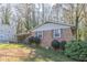 Brick ranch house with carport and mature trees at 3390 Kenland Se Rd, Smyrna, GA 30082