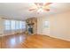 Hardwood floors, stone fireplace, and ceiling fan at 3390 Kenland Se Rd, Smyrna, GA 30082