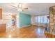 Hardwood floors, stone fireplace, and ceiling fan at 3390 Kenland Se Rd, Smyrna, GA 30082