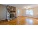 Hardwood floors, stone fireplace, and ceiling fan at 3390 Kenland Se Rd, Smyrna, GA 30082