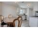 Kitchen dining area with wood table and four chairs at 540 Saddle Shoals Dr, Lawrenceville, GA 30046