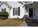 House entrance with black shutters and storm door at 540 Saddle Shoals Dr, Lawrenceville, GA 30046