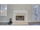 Living room with a white mantel and gas fireplace at 540 Saddle Shoals Dr, Lawrenceville, GA 30046