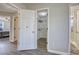 Hallway with doors to bedrooms and bathroom, vinyl flooring at 540 Saddle Shoals Dr, Lawrenceville, GA 30046