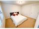 Cozy bedroom with carpet flooring, a neutral color palette, and a comfortable bed at 1055 Grove Valley Dr, Cumming, GA 30041