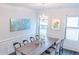 Elegant dining room with chandelier and large windows at 1055 Grove Valley Dr, Cumming, GA 30041