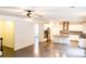 Open floor plan view of hardwood floors connecting the kitchen to the living spaces at 1055 Grove Valley Dr, Cumming, GA 30041