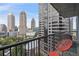 Private balcony with city skyline views and seating at 1080 Peachtree Ne St # 1402, Atlanta, GA 30309