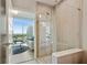 Spa-like bathroom with a walk-in shower and city view at 1080 Peachtree Ne St # 1402, Atlanta, GA 30309