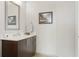 Modern bathroom with dark vanity and a large mirror at 1080 Peachtree Ne St # 1402, Atlanta, GA 30309