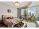 Modern bedroom with a king bed and access to balcony at 1080 Peachtree Ne St # 1402, Atlanta, GA 30309