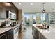 Modern kitchen with stainless steel appliances and city views at 1080 Peachtree Ne St # 1402, Atlanta, GA 30309