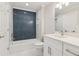 Bathroom with navy hexagon tile shower surround at 115 N Devereux Nw Ct, Atlanta, GA 30327